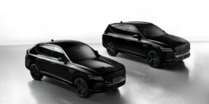 Sleek black Genesis GV80 SUVs showcased in a professional studio setting, emphasizing luxury and design.