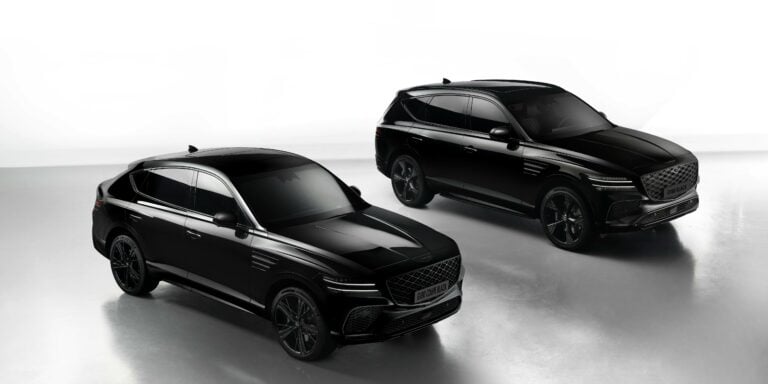 Sleek black Genesis GV80 SUVs showcased in a professional studio setting, emphasizing luxury and design.